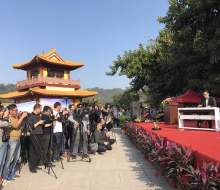 Carlo Aspri performs on stage while all the medias take videos and photos of him, at a very important event given in an exclusive Buddhist Temple, in Xiamen city, Fujian Province, China.