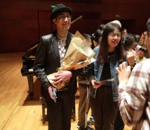 Fans taking photos with Carlo Aspri after his concert in China.