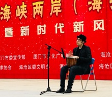 Carlo Aspri gives a "Djembe percussion" performance to a crowd of over 10,000 spectators, in Xiamen city, Fujian Province, China.