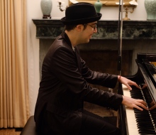 Carlo Aspri performs his compositions at the house of the Swiss Ambassador in Shanghai, China.