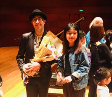 Carlo Aspri taking photos with his fans after his concert in China.