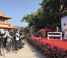 Carlo aspri performs the famous chinese song "The Waves Of Gulangyu" as all the medias take photos and videos of him, at an exclusive Buddha Temple in Xiamen city, Fujian Province, China.
