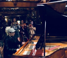 Fans take photos and videos of Carlo Aspri as he plays piano at the renowned Exclusive Club for Millionaires at the "East Wine Cellar" in Beijing, China.