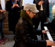 Fans taking videos and photos of Carlo Aspri as he played piano at a music shop in Xiamen city, Fujian, China.